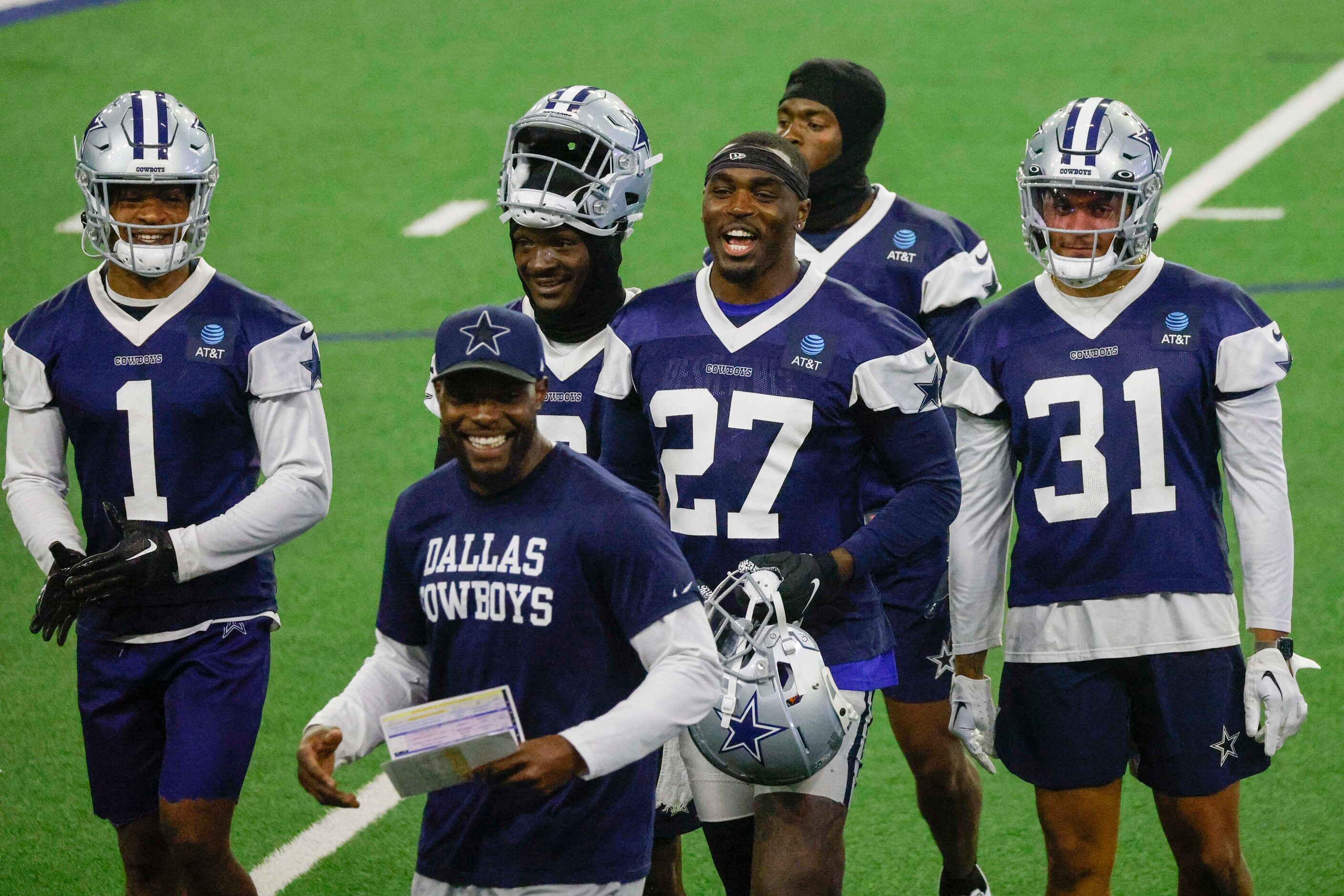 Dallas Cowboys safety Jayron Kearse (27) smiles as he leaves the field during timeout with...