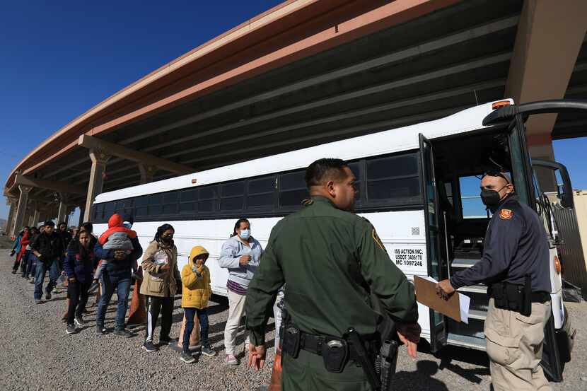 Migrants turn themselves into U.S. immigration authorities on Nov. 17 in El Paso.