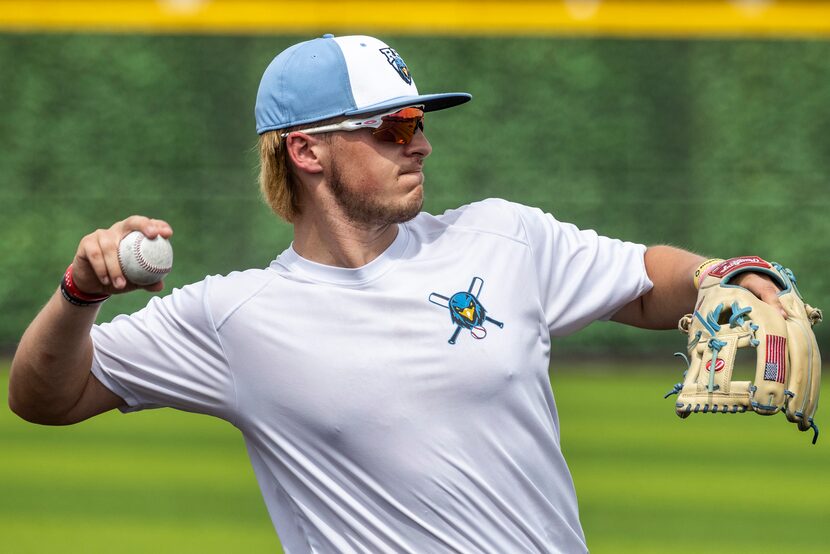 Varsity third baseman Josh Livingston returns the ball during an after school practice at...