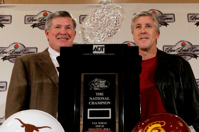 University of Texas head football coach Mack Brown, left, and Southern California head coach...