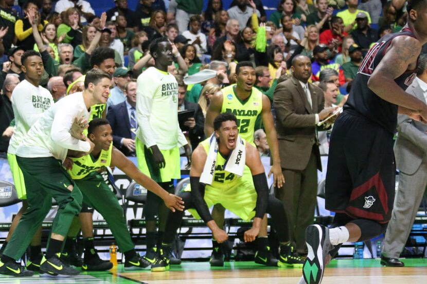 The Baylor bench reacts to a dunk in the second half during the Baylor Bears vs. the New...