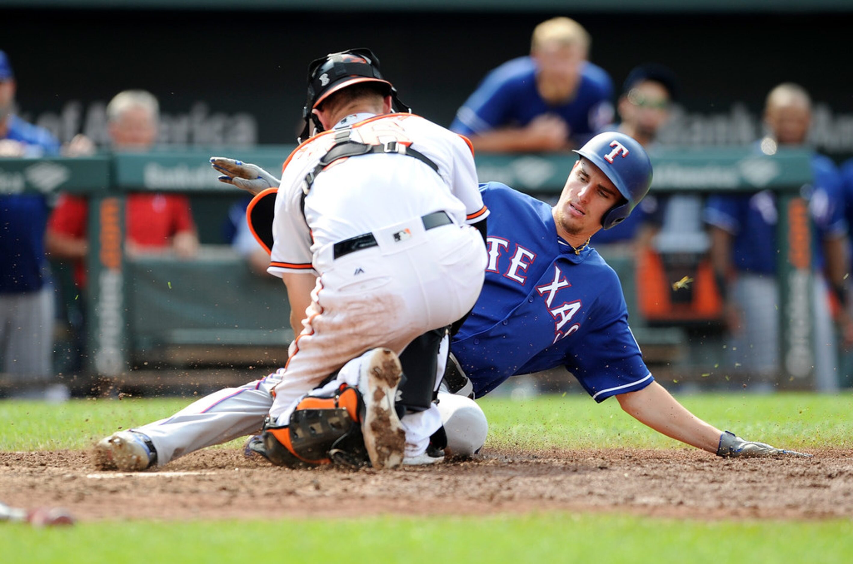 BALTIMORE, MD - JULY 15:  Carlos Tocci #15 of the Texas Rangers is tagged out at home plate...