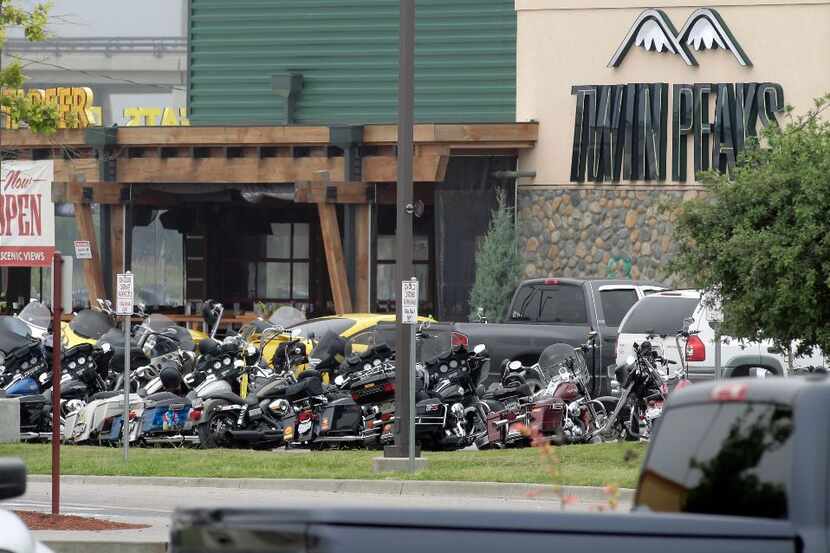WACO, TX - MAY 18: Dozens of motorcycles remain outside the Twin Peaks restaurant, the scene...