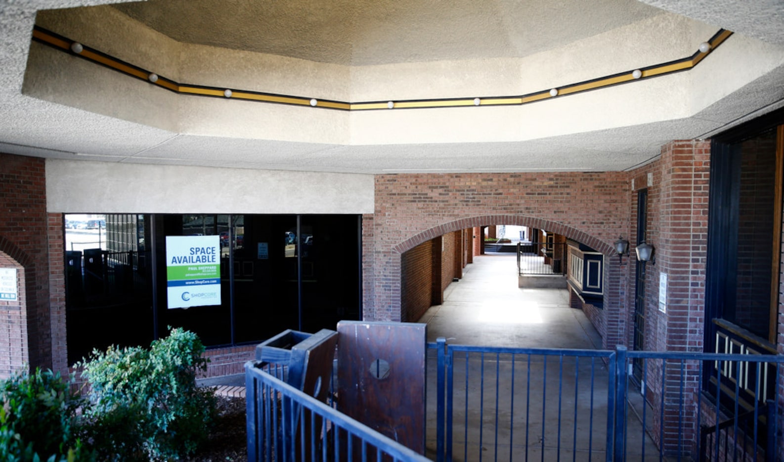 A empty building with a "space available" sign on one of the properties at Lincoln Square...