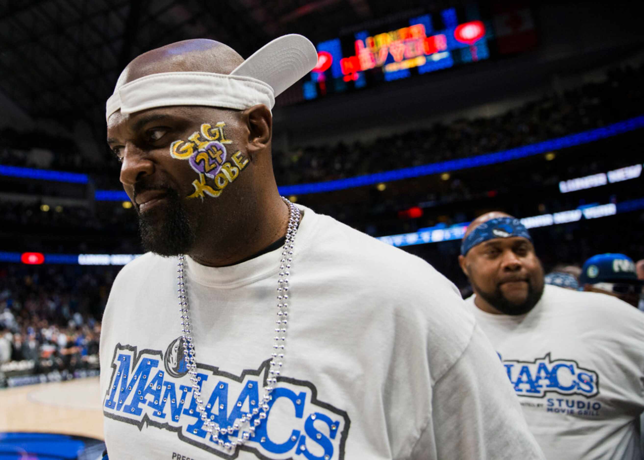 A member of the Mavs Maniacs painted his face in honor of former Los Angeles Laker Kobe...