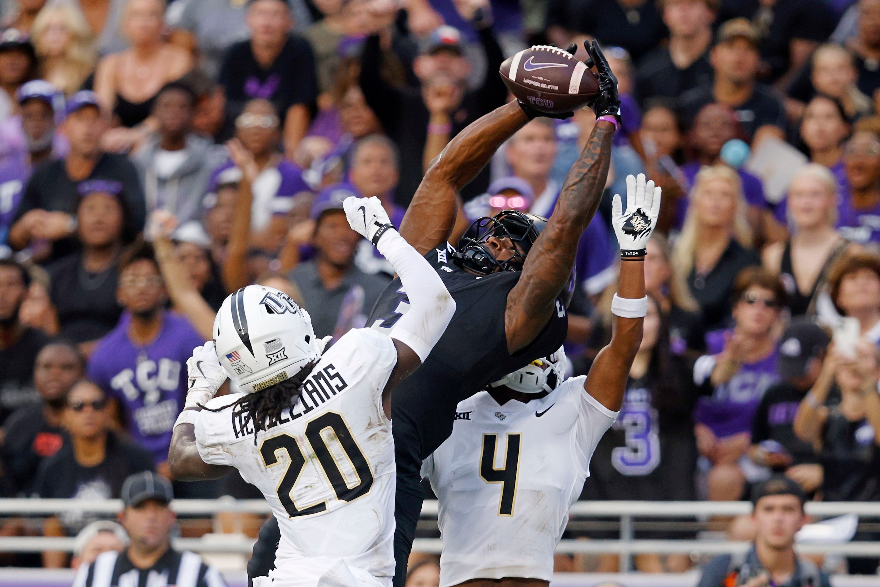 TCU wide receiver Savion Williams (3) catches a pass and scores a touchdown against UCF...