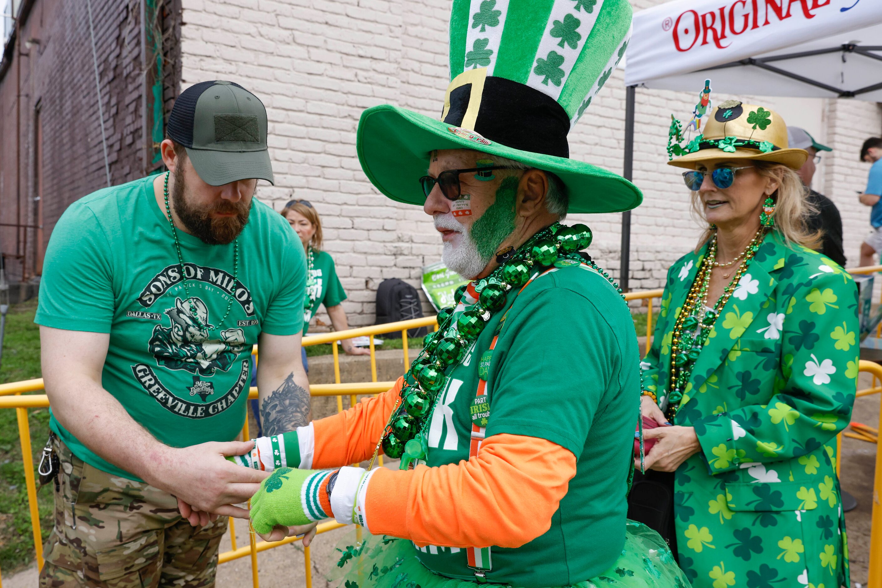 Larry Williams checks in to enter a block party during a Saint Patrick's Day parade on...