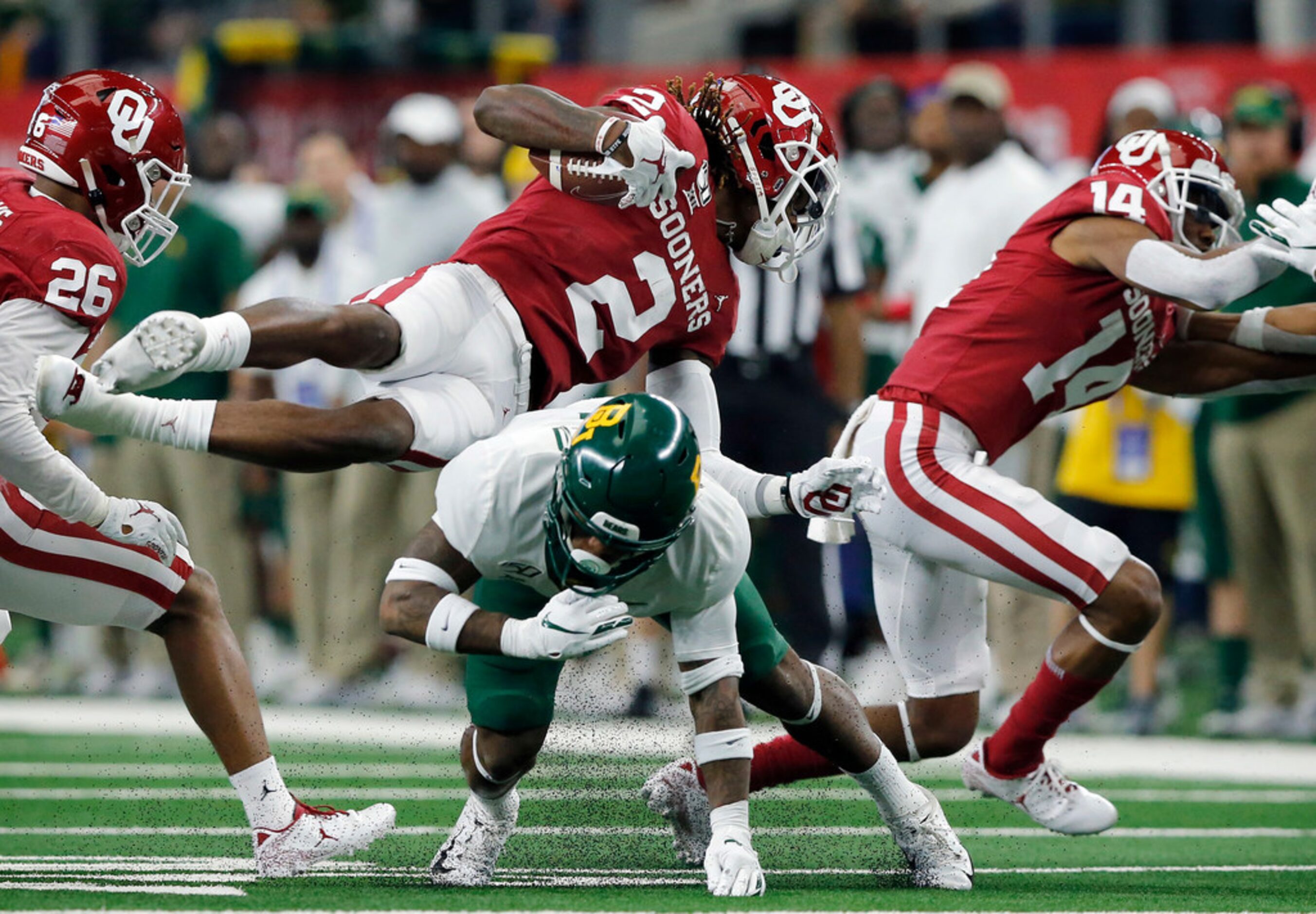 Baylor Bears cornerback Grayland Arnold (1) upends Oklahoma Sooners wide receiver CeeDee...