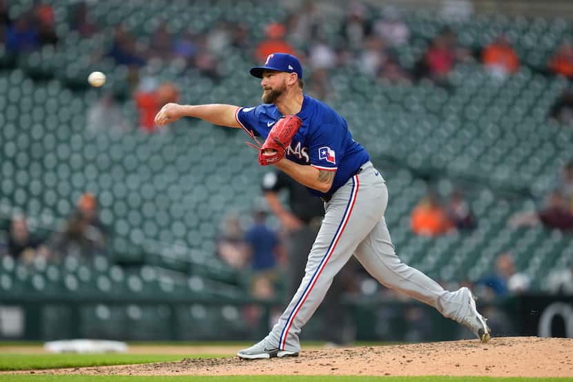 Texas Rangers pitcher Kirby Yates throws against the Detroit Tigers in the ninth inning of a...