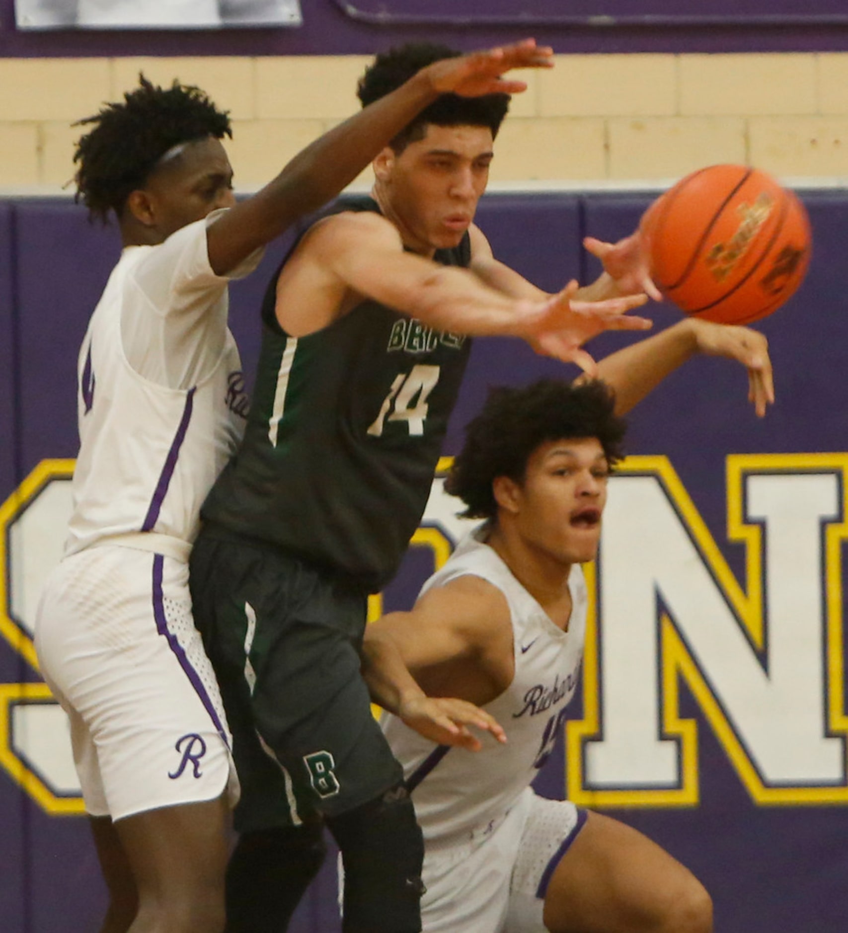 Richardson Berkner's Jeremy McCampbell (14) looks to pass out of trouble as he is surrounded...