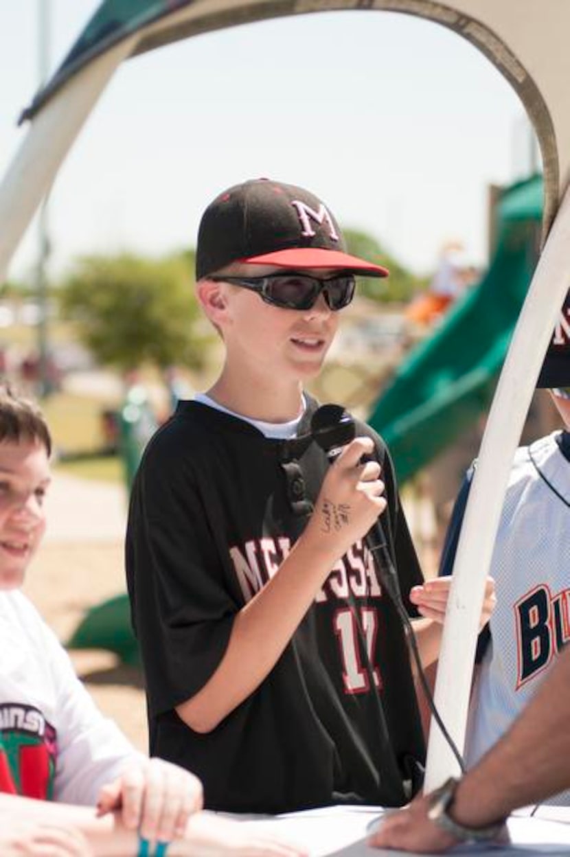 Geordon Cox gives a radio interview during Strikes Against Cancer.