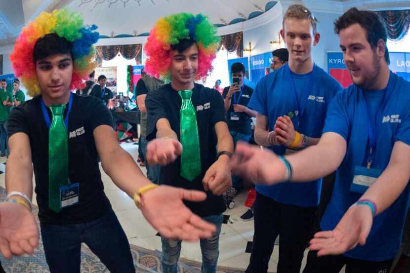 Computer aficionados from Lebanon (rainbow hair) and Oceania(blue shirts) dance  in the...