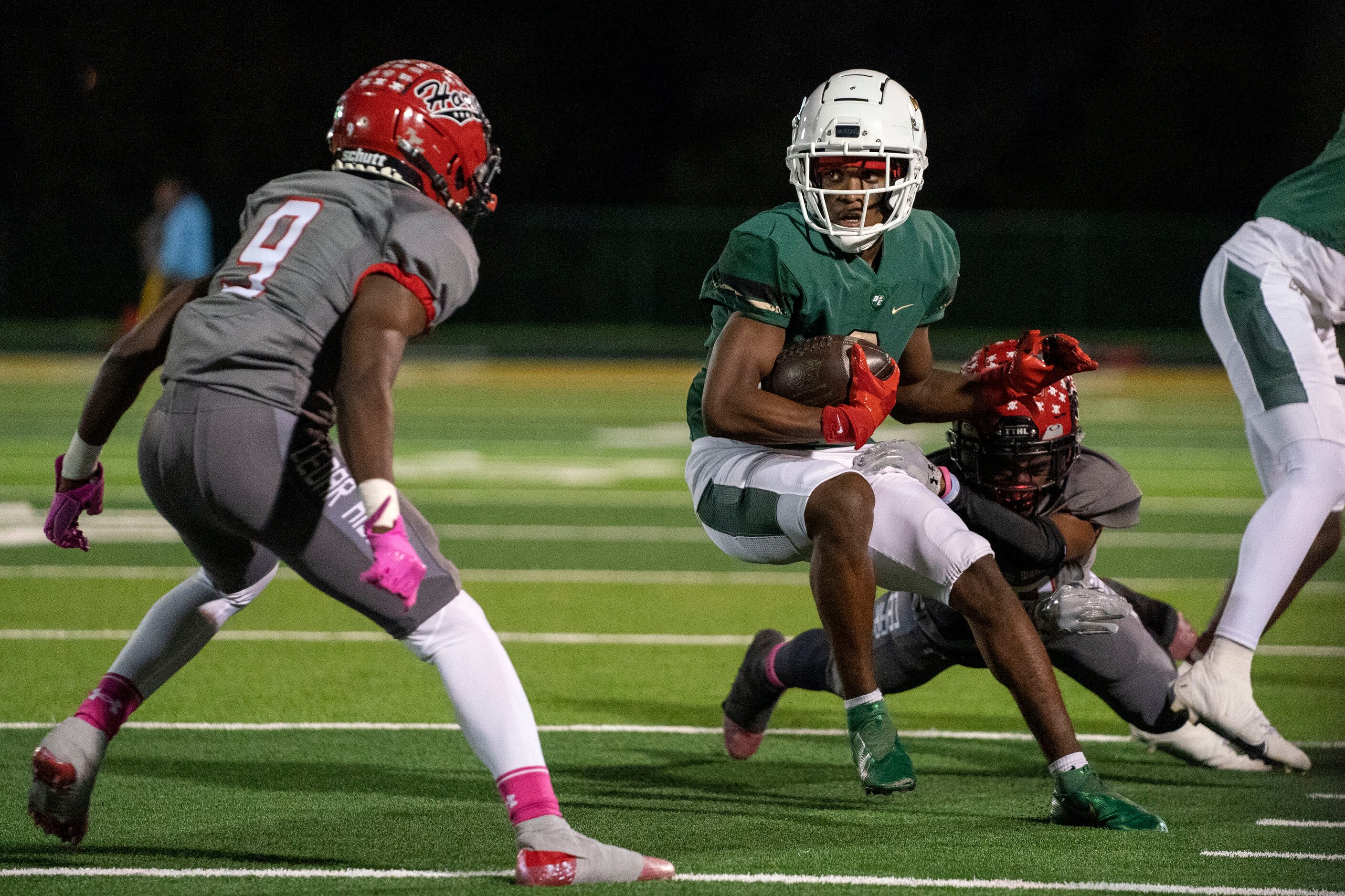 DeSoto senior wide receiver Mike Murphy (2) looks for yards after the catch against Cedar...