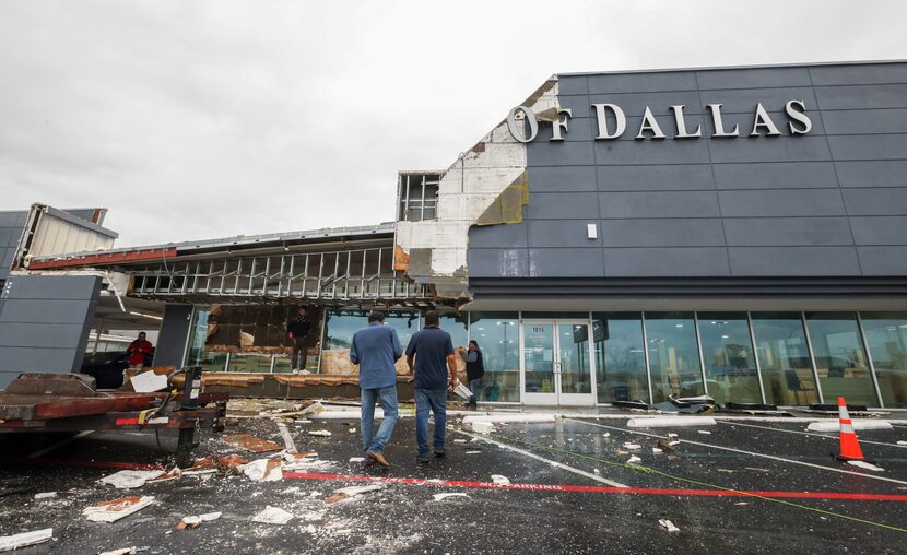 General manager David Mullins (left) walks with Rafael Domingues (right) as they assess the...