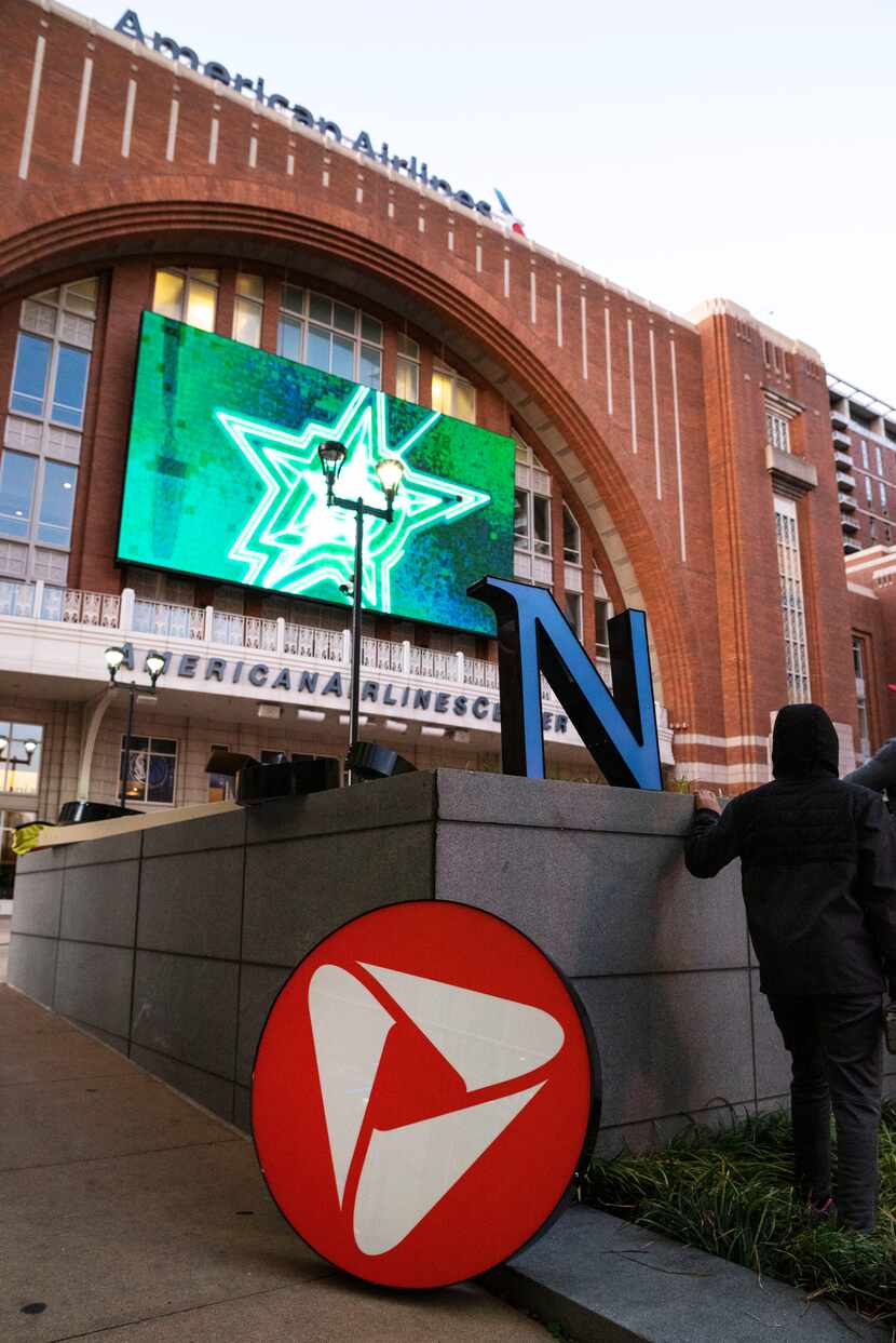 A crew spent Monday preparing to install the PNC Bank logo at Victory Plaza outside the...
