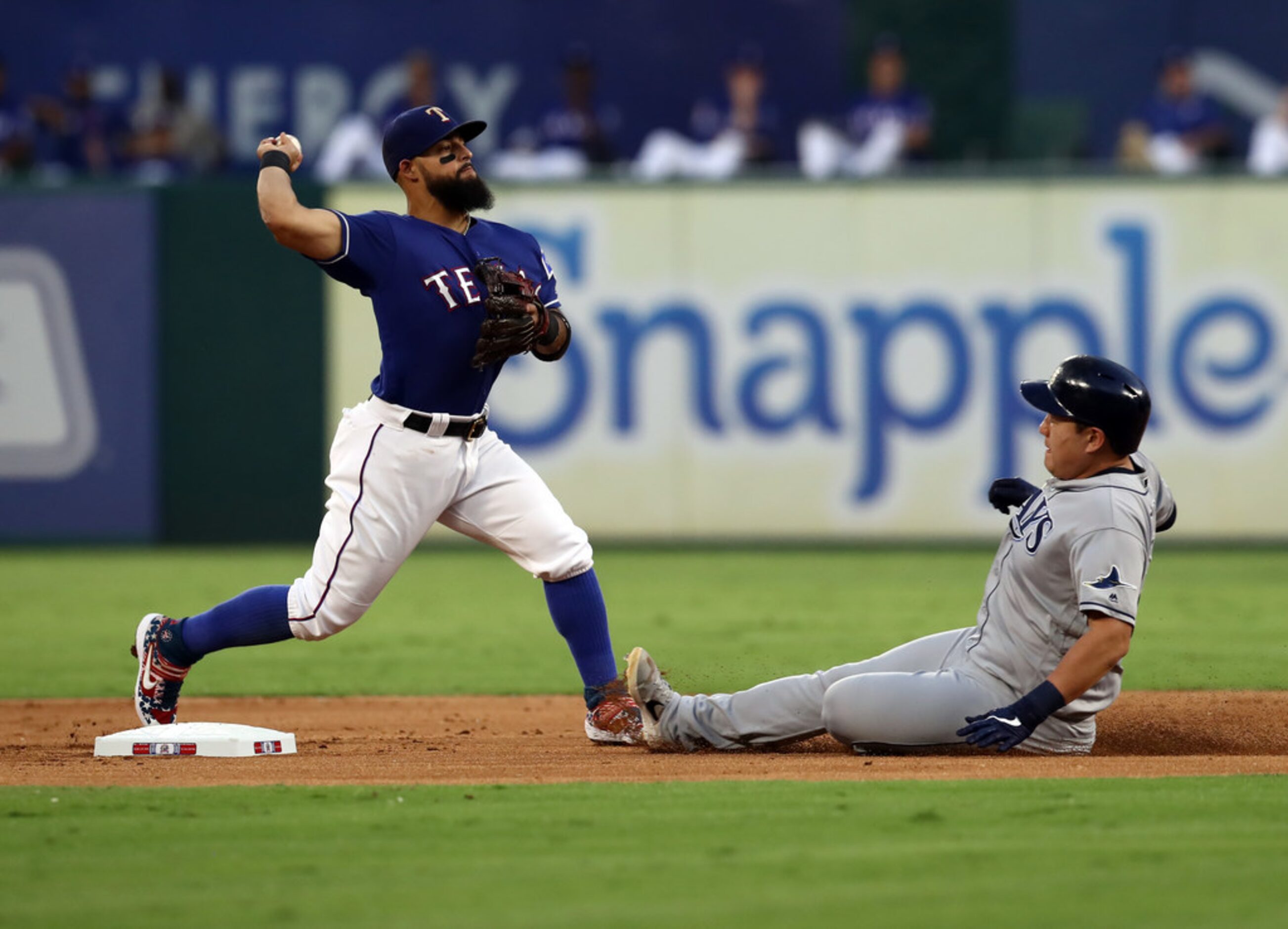 ARLINGTON, TEXAS - SEPTEMBER 10:  Rougned Odor #12 of the Texas Rangers makes the out...