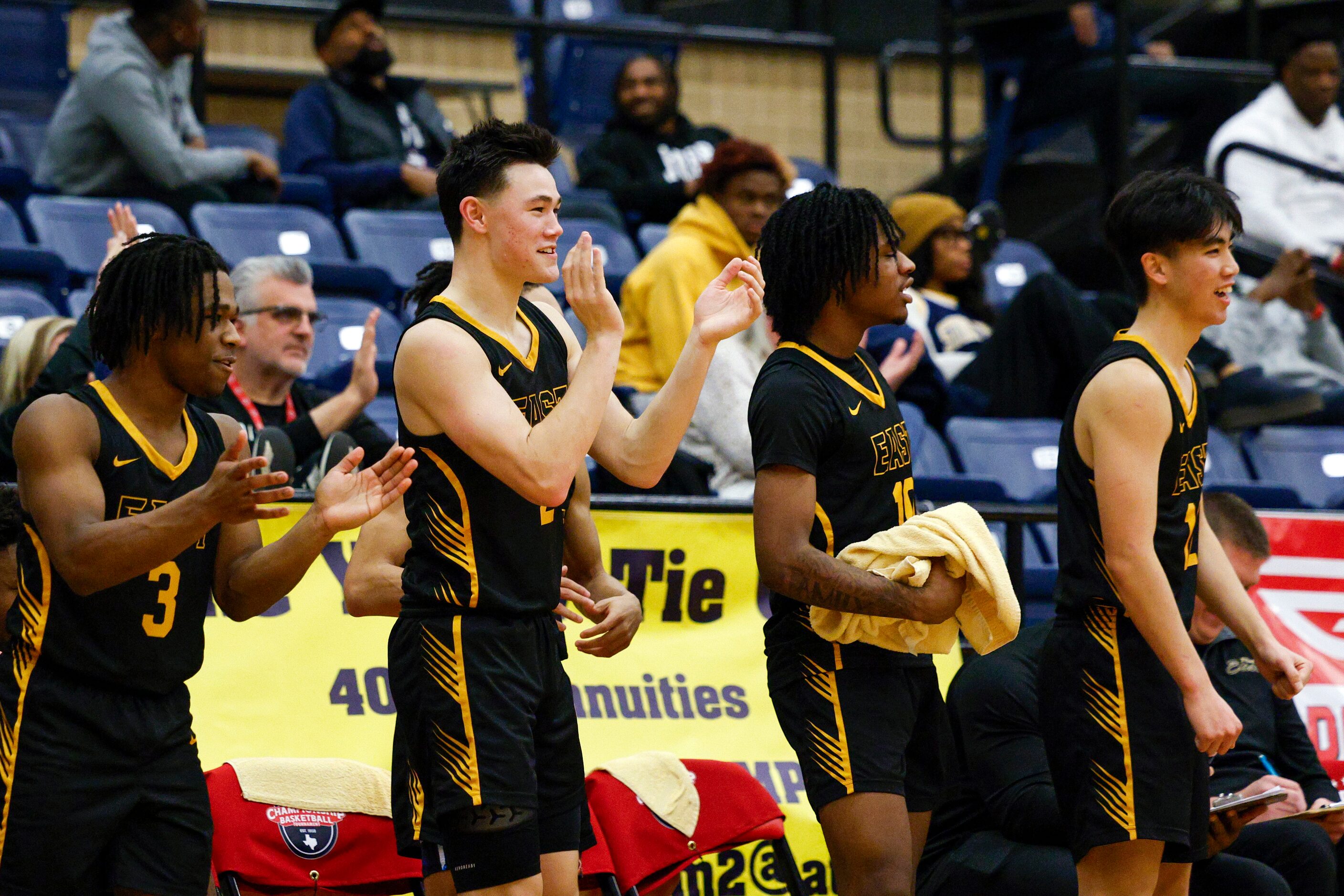 Plano East players celebrate a basket during the second half of a first-round game against...