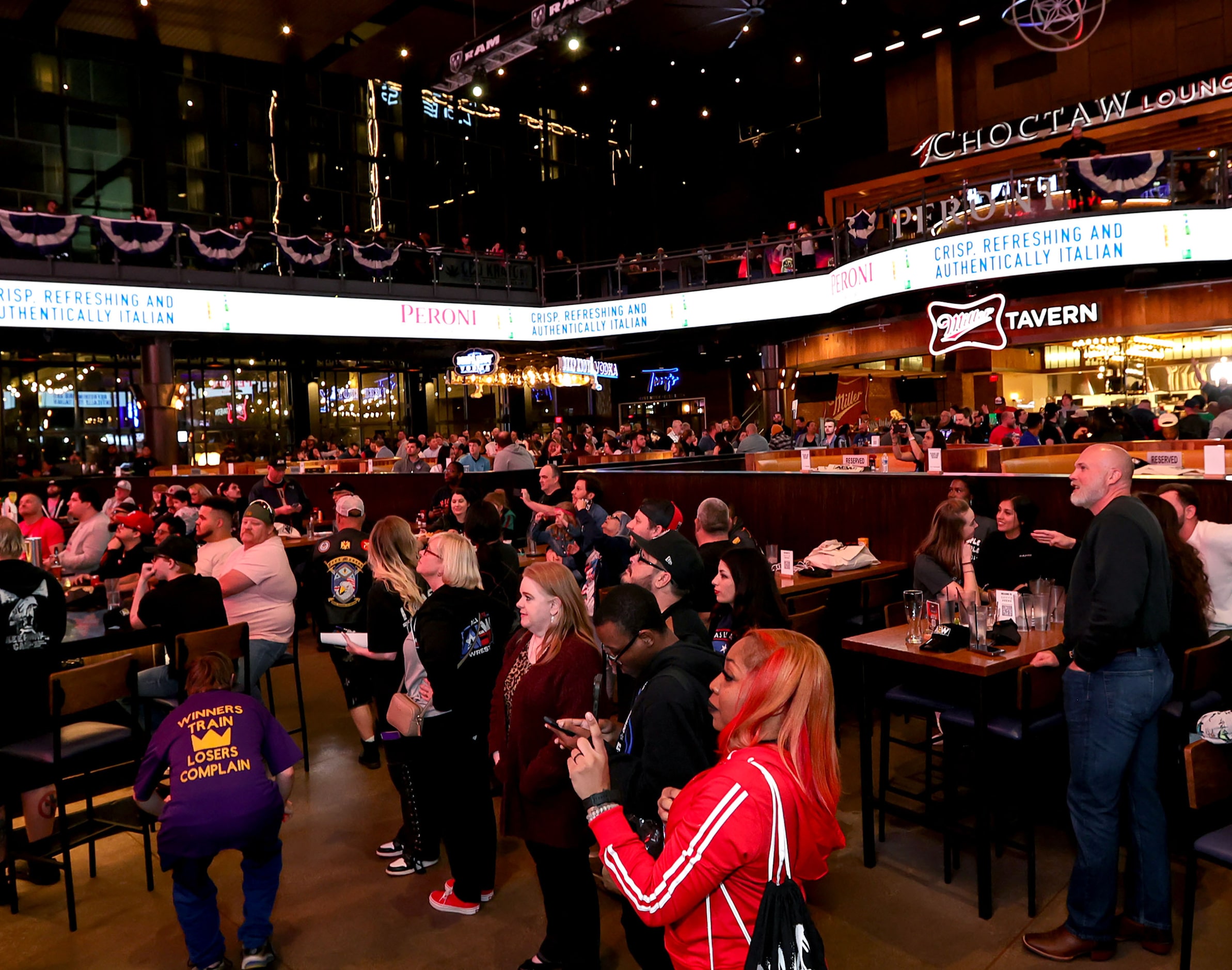 Fans look on at the All Elite Wrestling kickoff party on Wednesday, November 20, 2024 at...