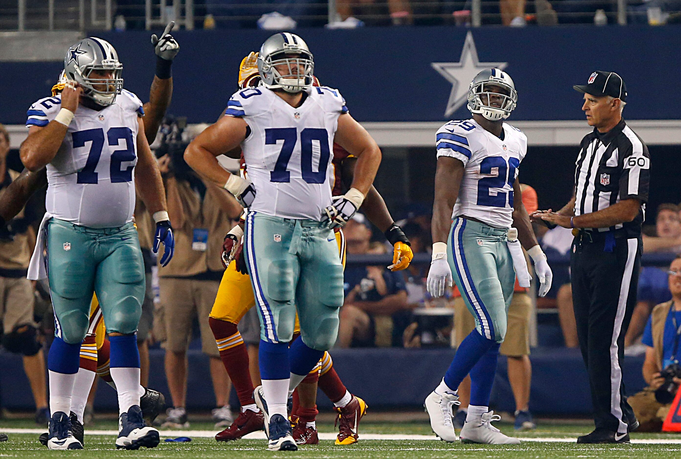 Dallas Cowboys running back DeMarco Murray (29) walks off the field after fumbling the ball...