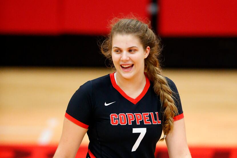 Coppell High senior volleyball player Pierce Woodall laughs along with her teammates as they...