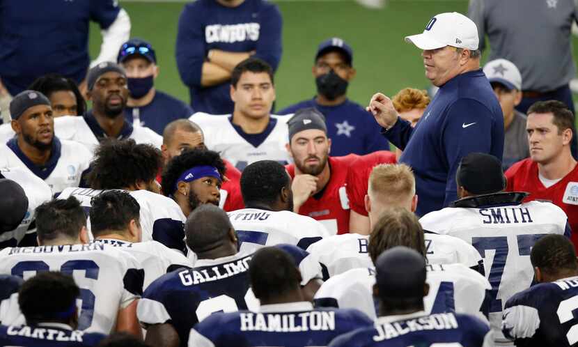 Dallas Cowboys head coach Mike McCarthy talks to the players after practice during training...
