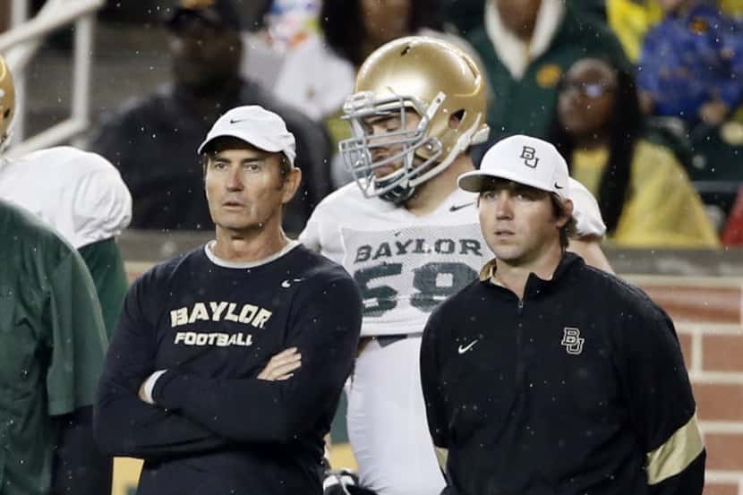 FILE - In this March 20, 2015 photo, then-Baylor coach Art Briles, left, and then-offensive...