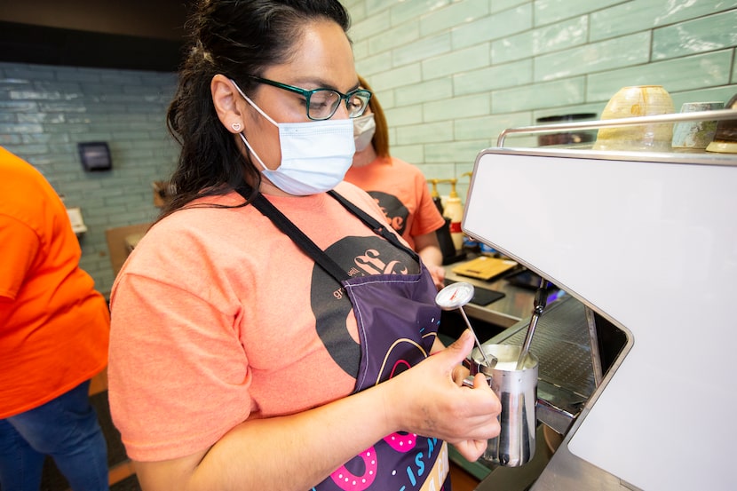 Maricela Espinosa prepares a latte for a customer at Well Grounded Coffee Community.