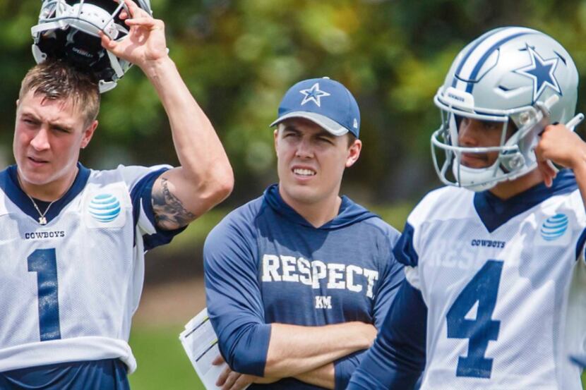 Dallas Cowboys quarterbacks coach Kellen Moore watches a drill with quarterbacks Dalton...