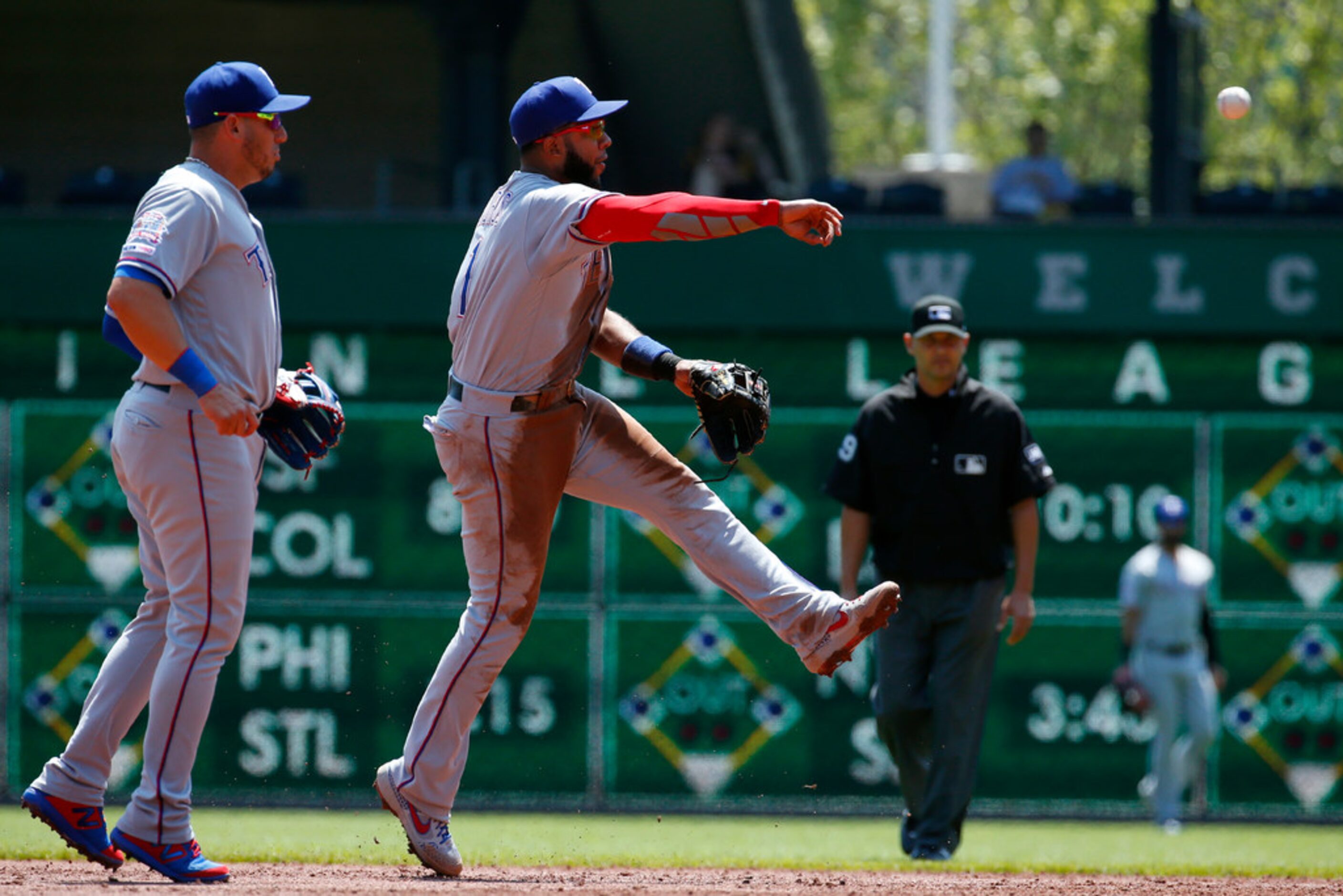 PITTSBURGH, PA - MAY 08:  Elvis Andrus #1 of the Texas Rangers makes a throw to first in the...