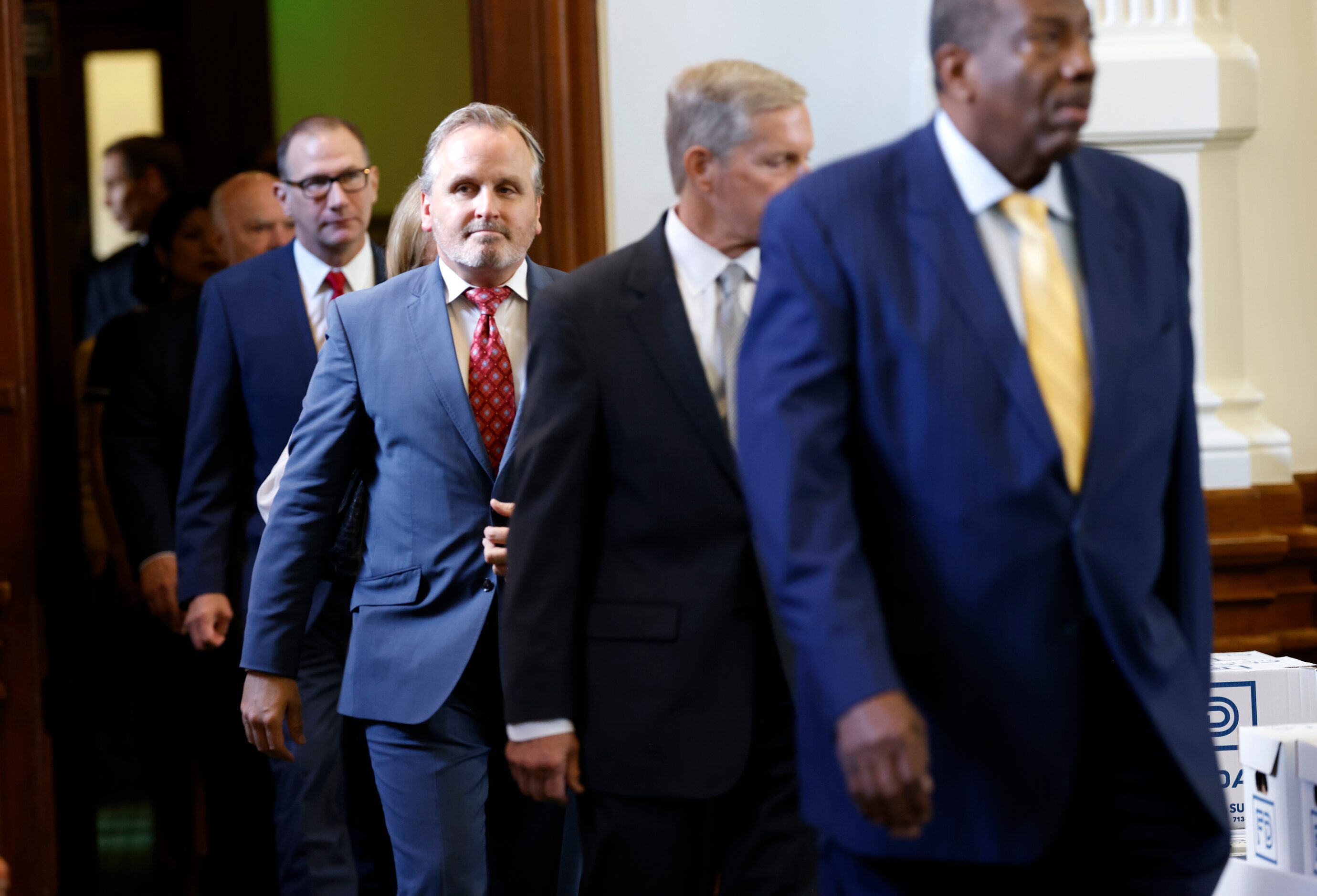 Texas Sen. Bryan Hughes, R-Mineola, walks in to the Senate chamber along with other senators...