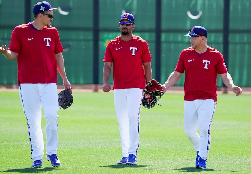 From left, Texas Rangers infielder Corey Seager, infielder Marcus Semien and outfielder Kole...