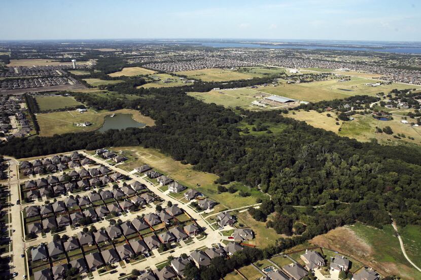 Aerial view of homes in Wylie with Lavon Lake in the distance. (Vernon Bryant/The Dallas...