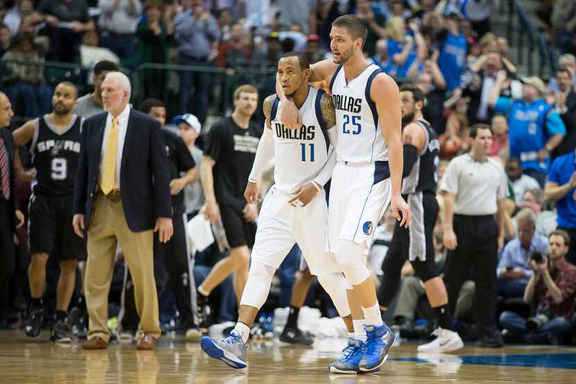 Dallas Mavericks forward Chandler Parsons (25) celebrates with guard Monta Ellis (11) after...