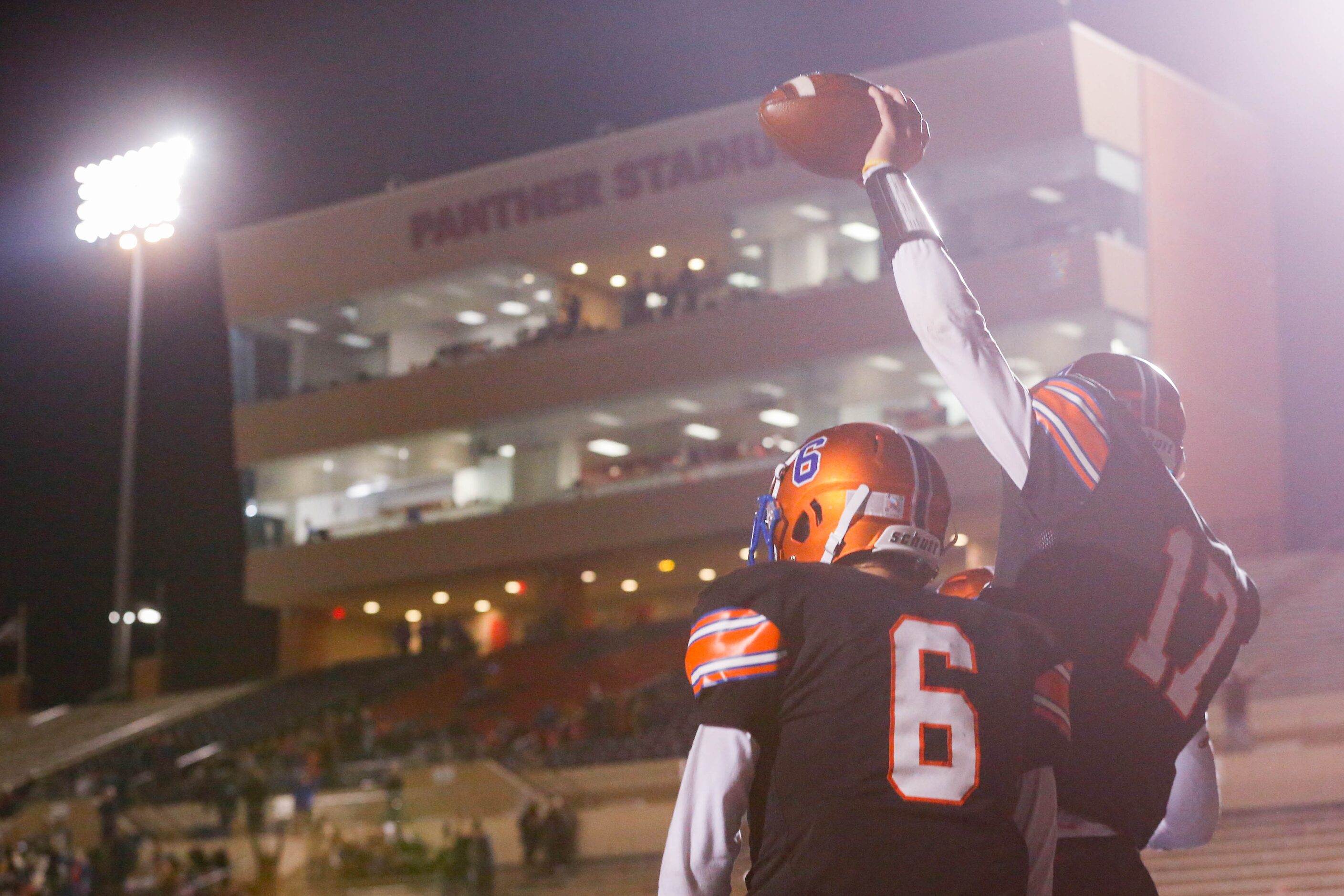 Colleyville Covenant's Austin Scheets (17) and Caleb Turner (6) celebrate a touchdown...