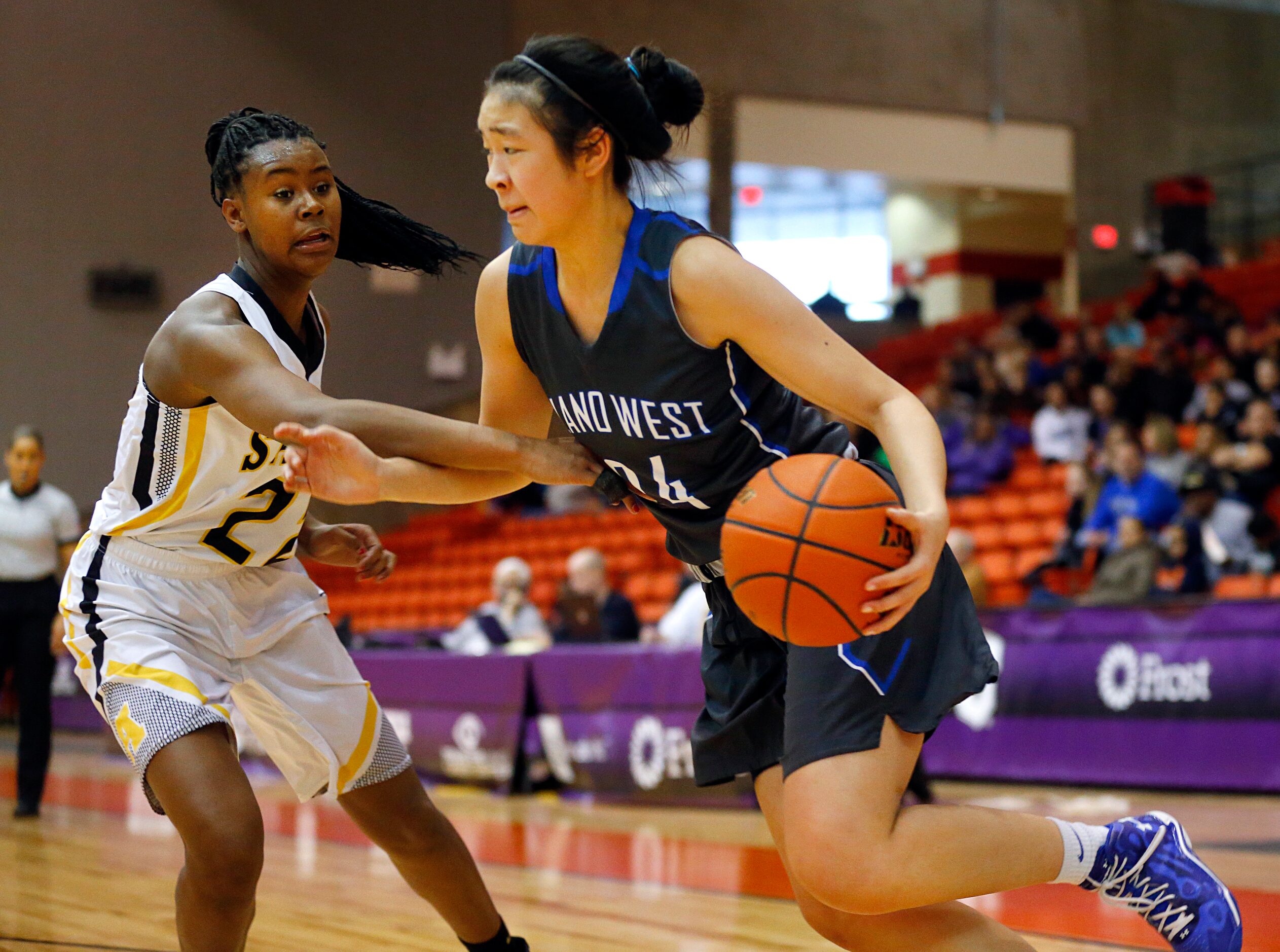 Plano West Natalie Chou (24) dribbles past Amarillo's Sidney Tinner (22) in the second half...