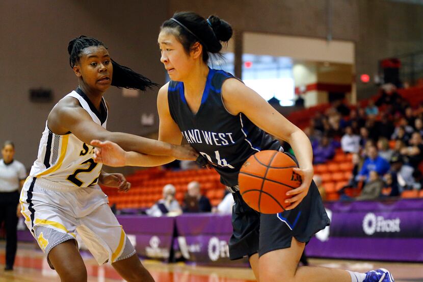Plano West Natalie Chou (24) dribbles past Amarillo's Sidney Tinner (22) in the second half...