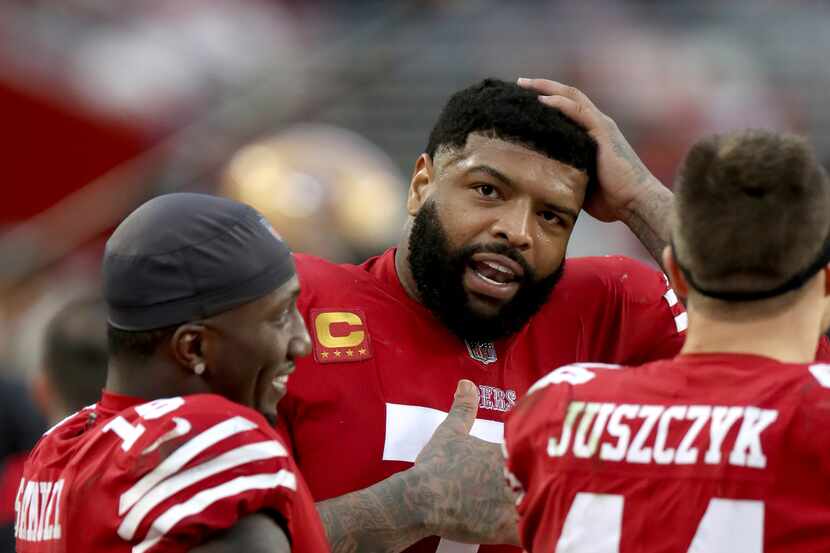 San Francisco 49ers offensive tackle Trent Williams (71) talks with San Francisco 49ers wide...
