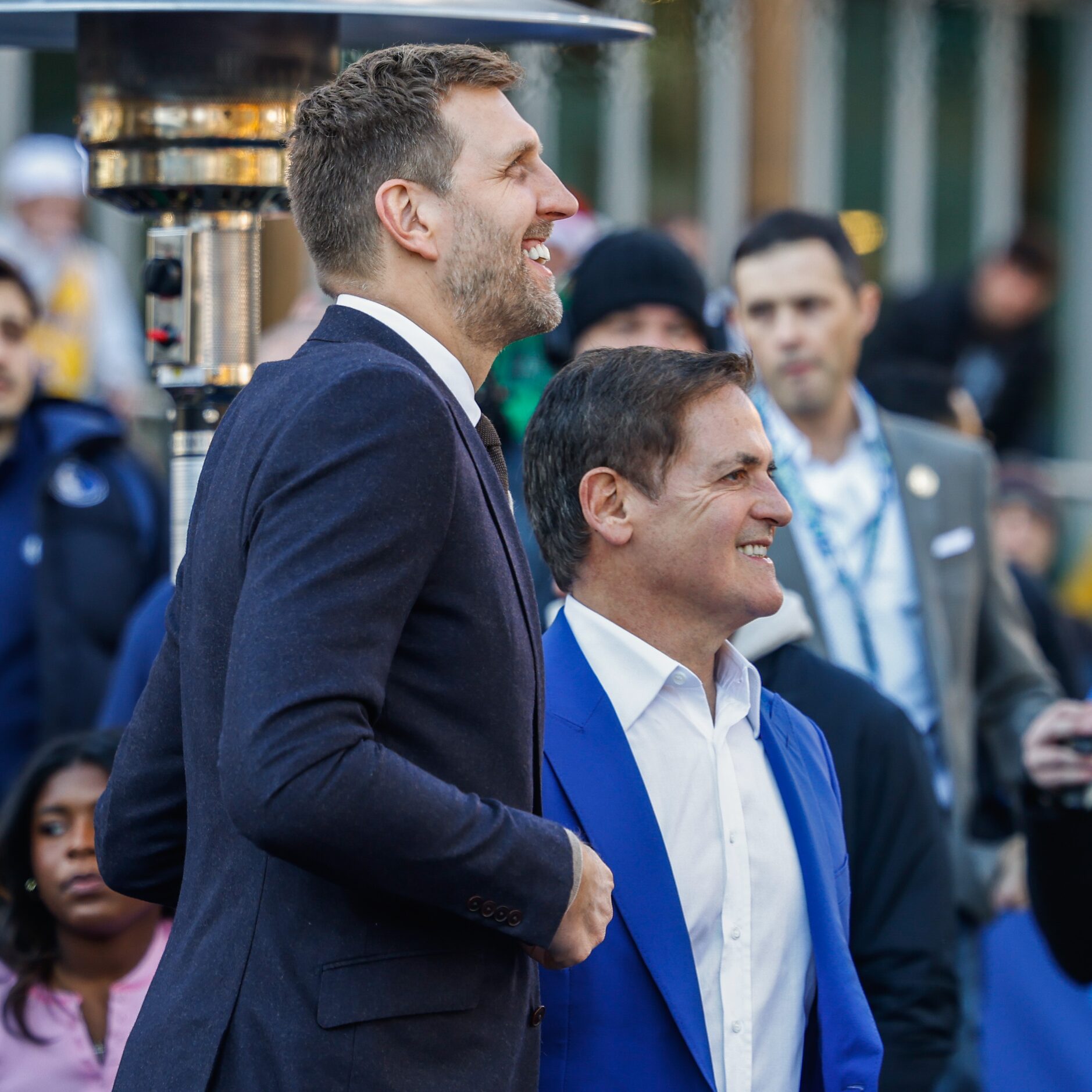 From left, Dirk Nowitzki, and Mark Cuban take a look at the Dirk Nowitzki statue during the...