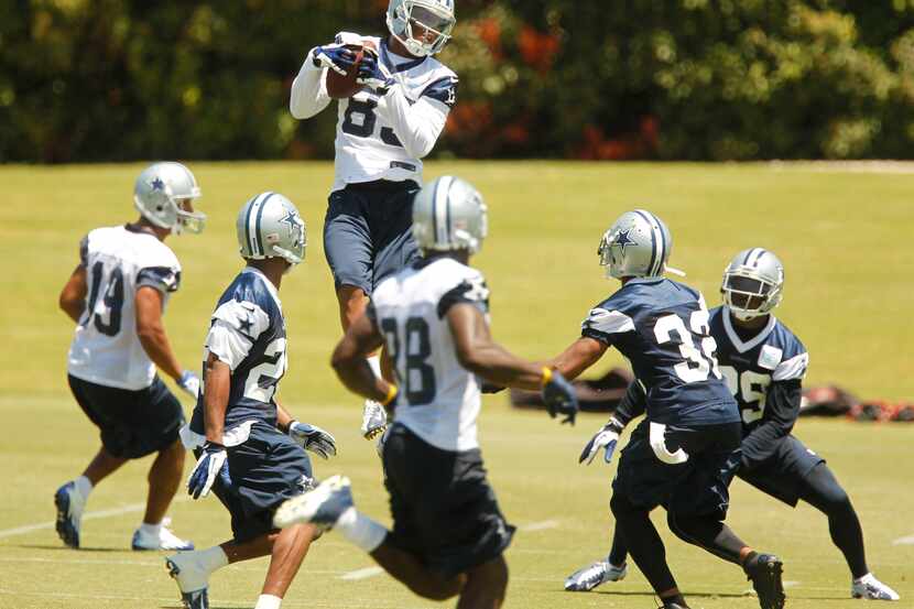 Dallas Cowboys receiver Terrence Williams catches a pass  during the last day of minicamp.