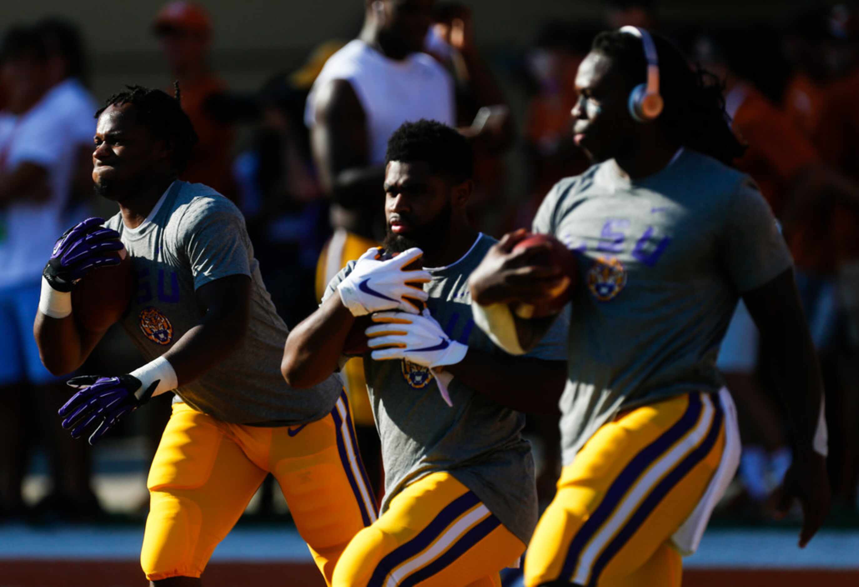 LSU Tigers players warm up prior to a college football game between the University of Texas...