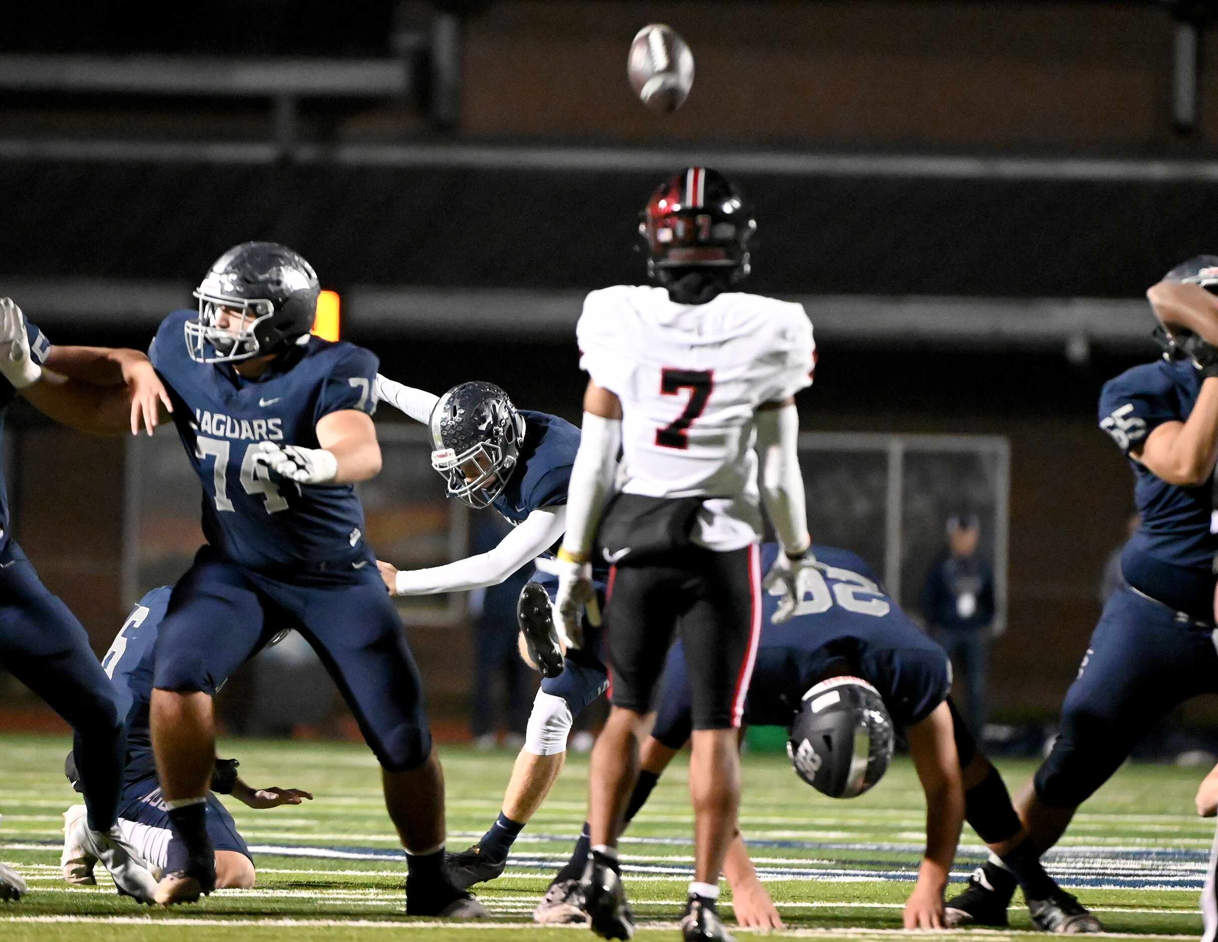 Flower Mound's Reagan Tubbs (1) kicks a 52-yard field goal at the end of the first half of a...