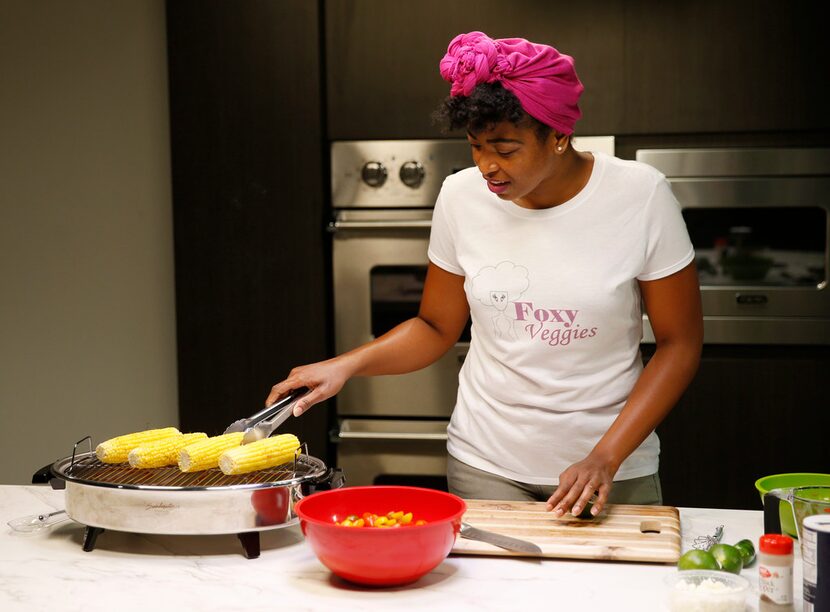 Ashley Douglas grills corn for a salad. 