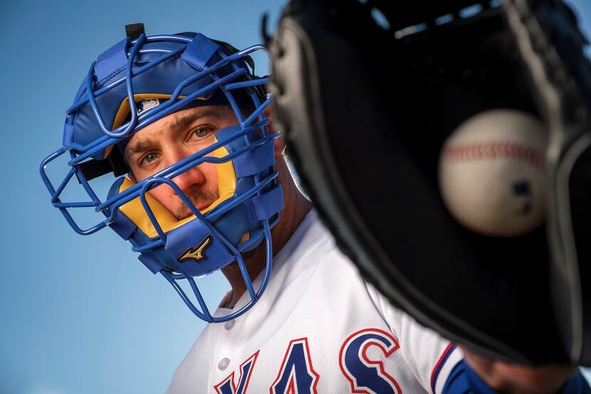 Texas Rangers catcher Jeff Mathis poses for a photograph during spring training photo day at...