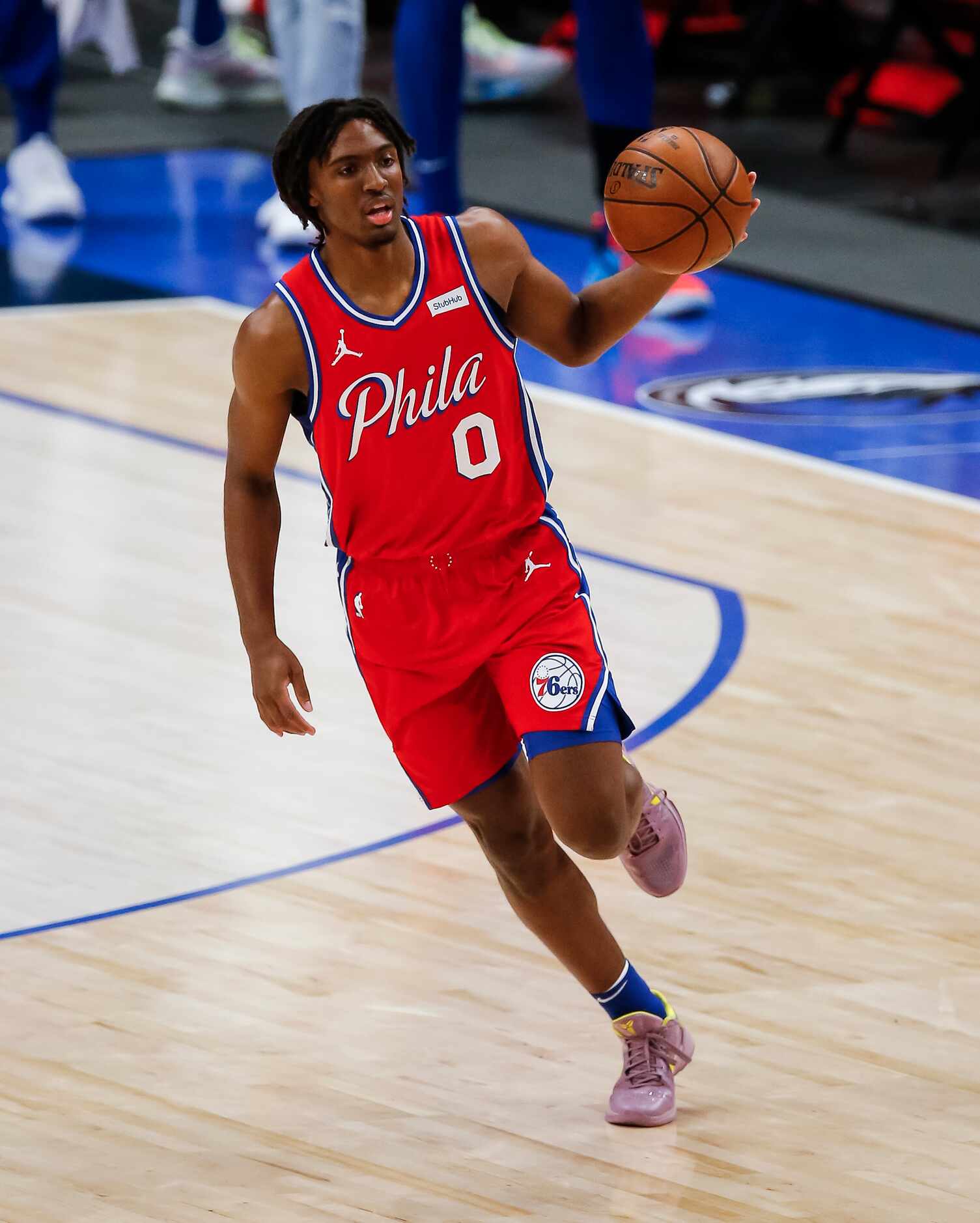 Philadelphia 76ers guard Tyrese Maxey (0) drives up the court during the second half of an...
