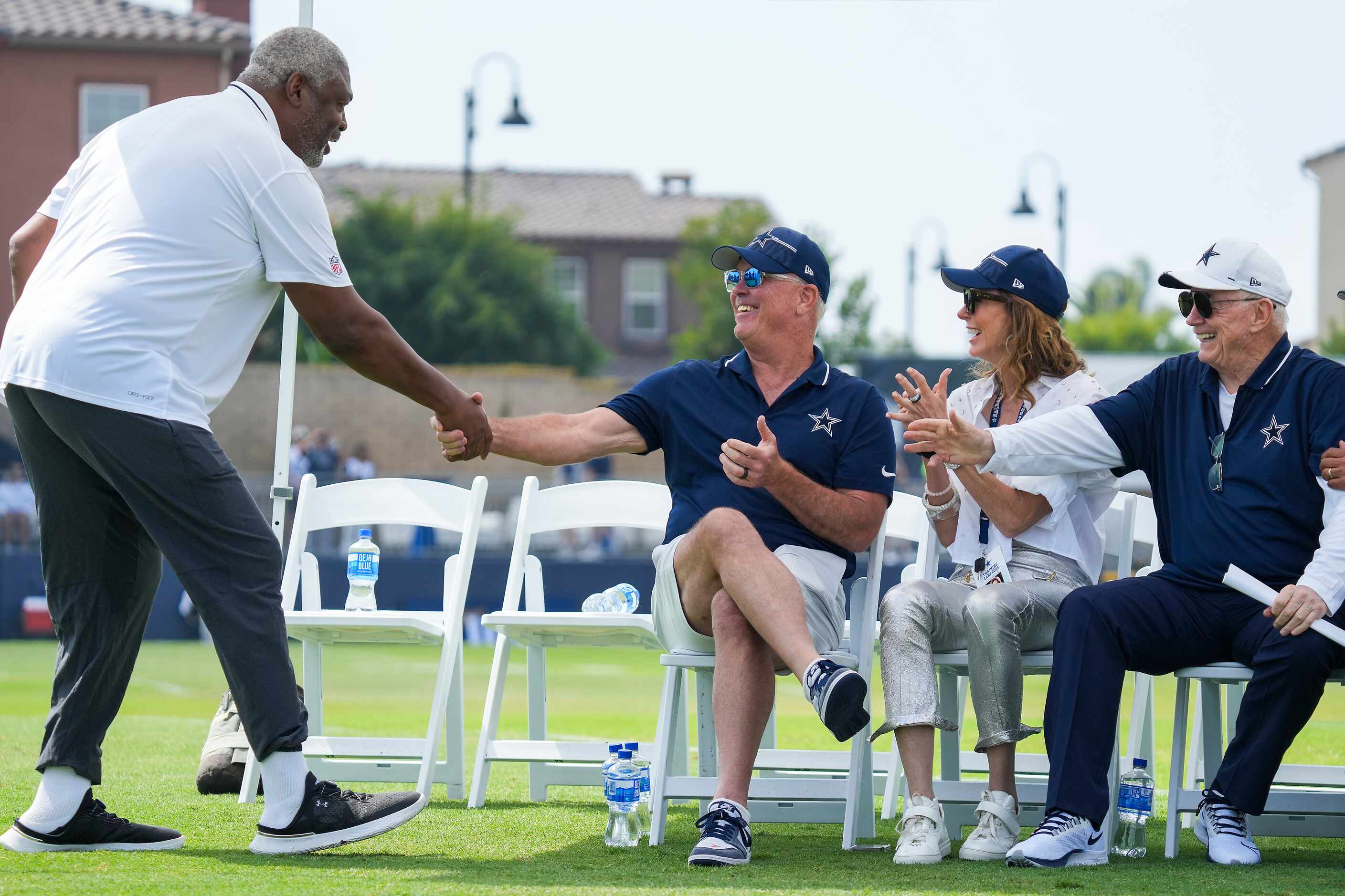 Former Dallas Cowboys player Charles Haley greets Cowboys executive vice president Stephen...