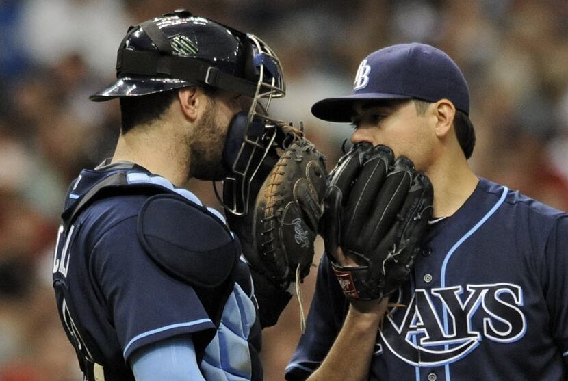 Tampa Bay Rays catcher Curt Casali, left, talks with starter Matt Moore on the mound during...