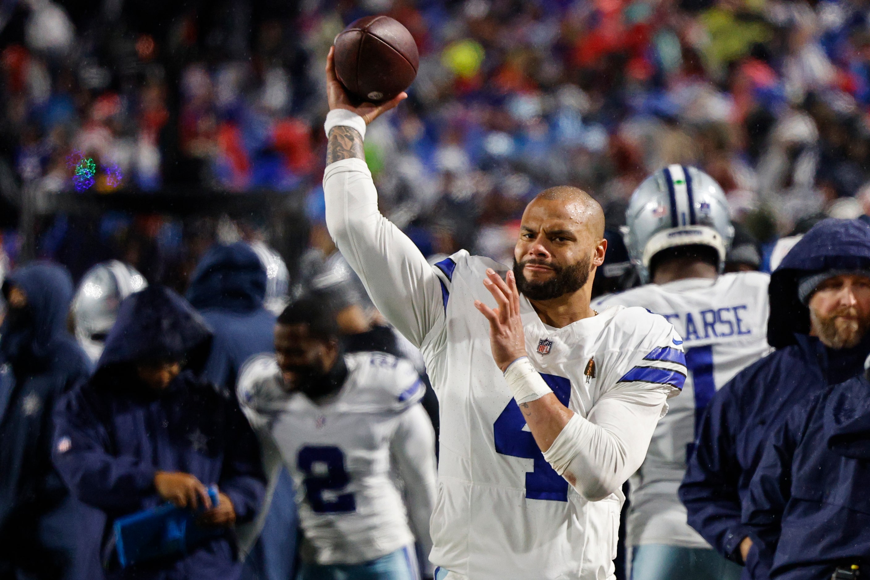 Dallas Cowboys quarterback Dak Prescott (4) warms up on the sideline during the second half...