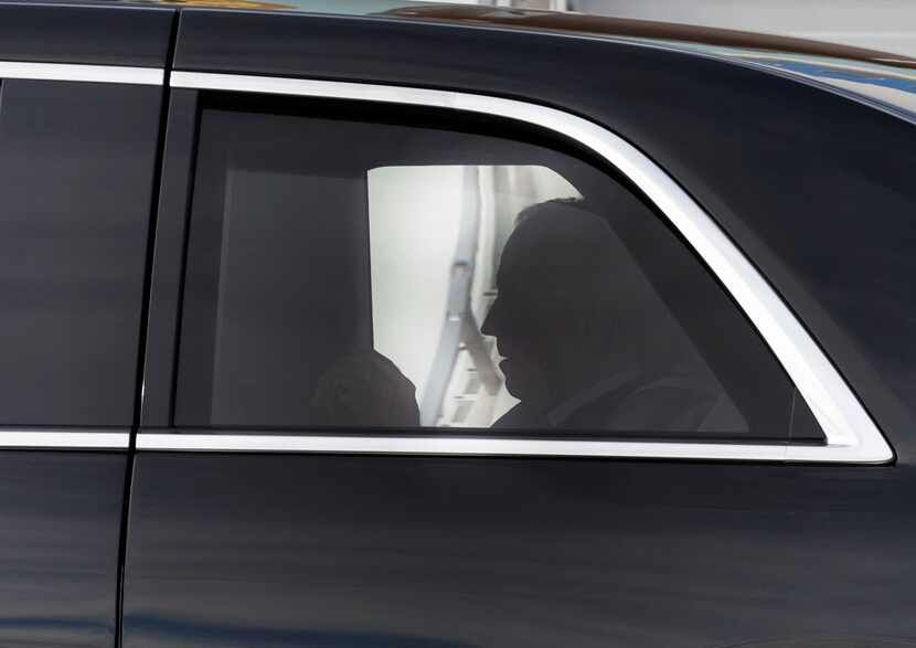 President Joe Biden sits in his limousine after his arrival at Dallas Fort Worth...