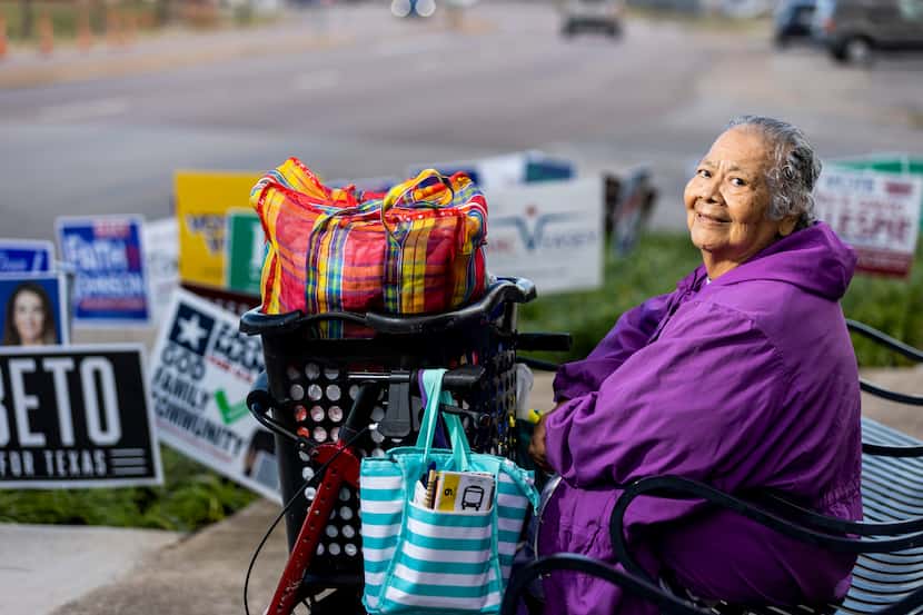 Delmira L. Esquivel waits for a DART bus after voting at the Oak Cliff Government Center in...