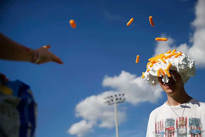  Anthony Parker, 7, throws cheetos at family friend Joshua Stockwell (right), both of Allen,...